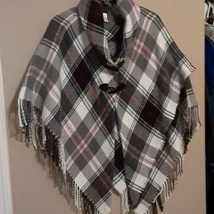 Plaid One Size Shawl with 2 buttons. Colors are White, Black, Grey and Pink.